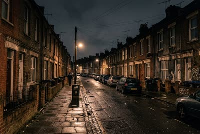 A terraced street at night